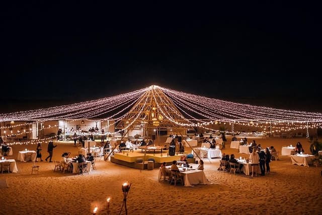 Luxury desert camp under starry night sky in Dubai